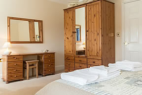 Wardrobe and dressing table in double bedroom